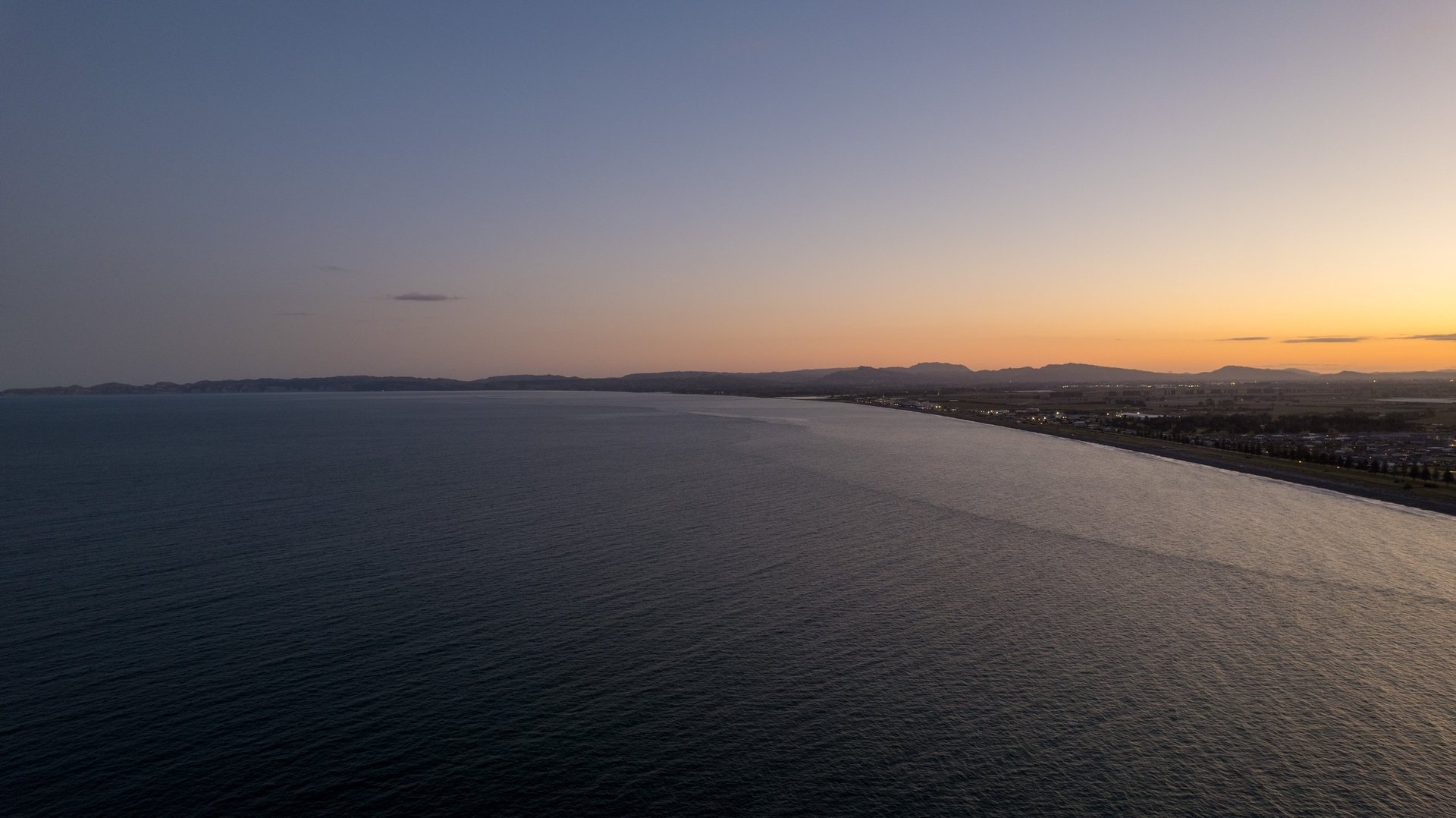 Looking south from Napier to Cape Kidnappers at night over the sea